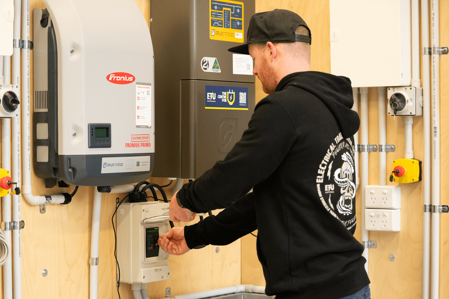 Electrical Trades Union of Victoria member working on switch in Centre For U classroom Electrical Trades Union of Victoria member working on switch in Centre For U classroom